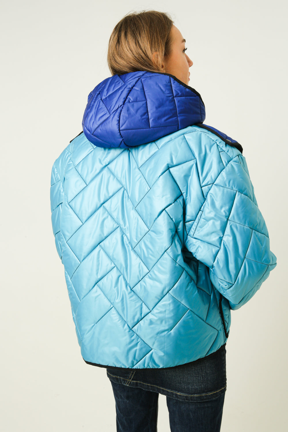 Down jacket in the style of deconstruction
